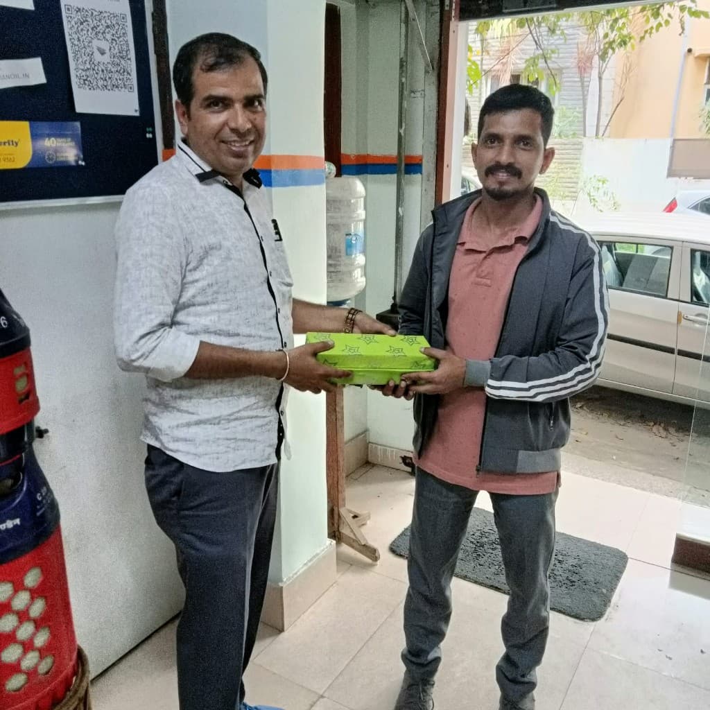 Gift handover at an HP Gas service centre