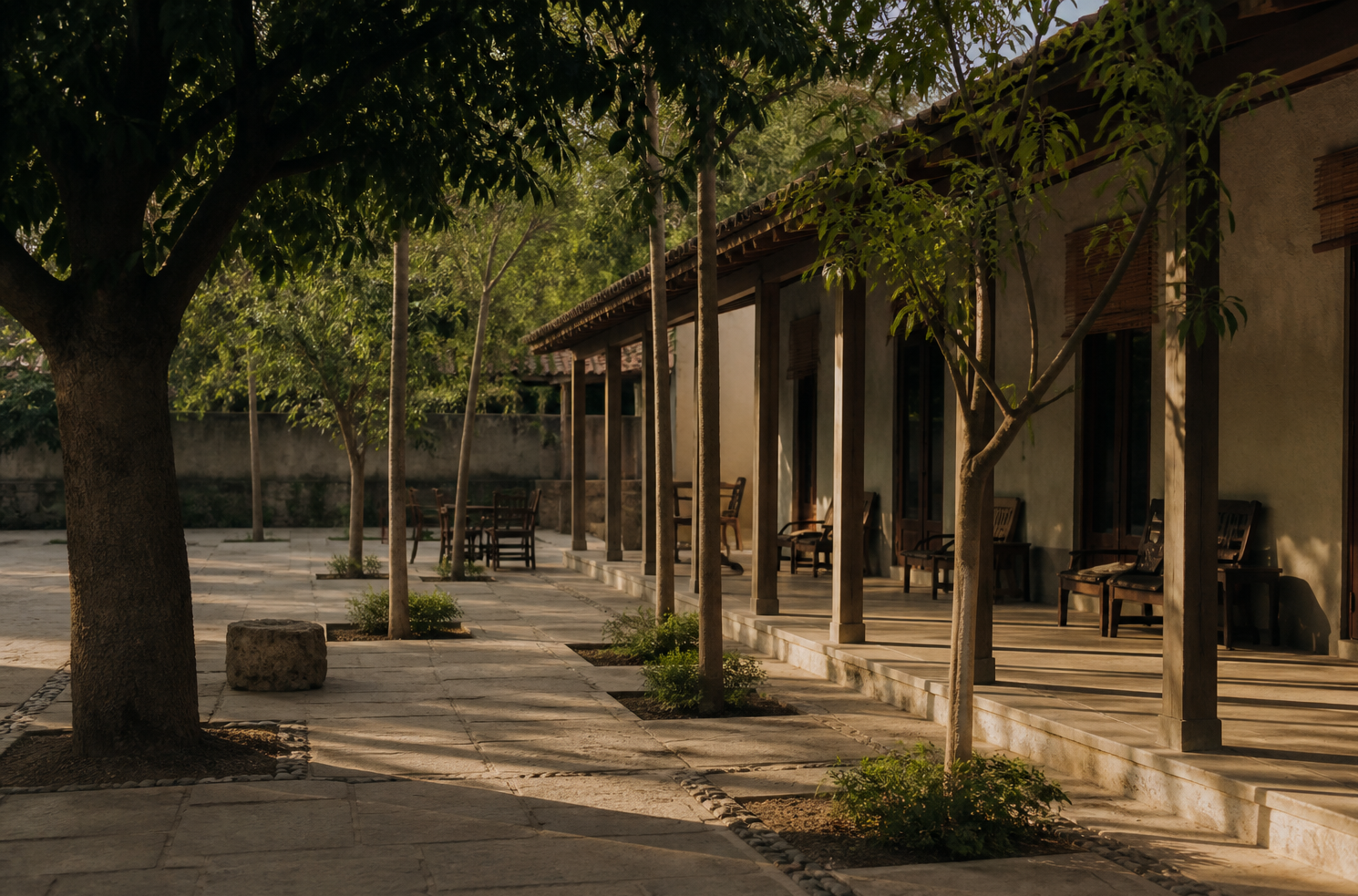 A quiet hotel courtyard in late afternoon light